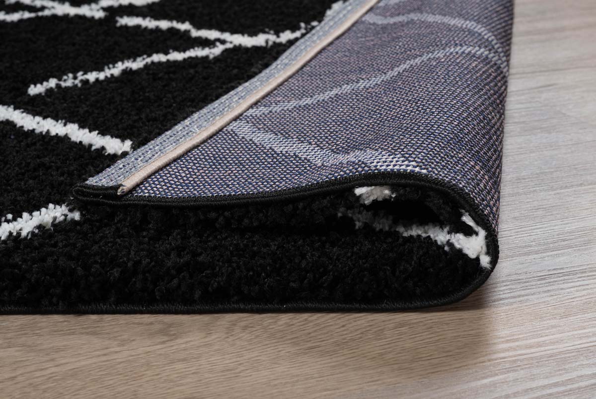 Dywan z długim włosiem w romby Artisan - czarny/biały - close up vouw Dywan z długim włosiem w romby Artisan - czarny/biały - close up vouw