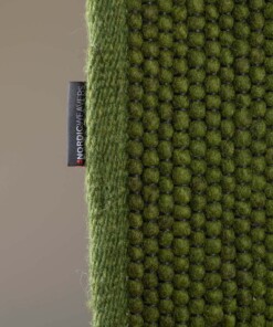 Dywan wełniany - Lett zielony - close up zijkant, thumbnail Dywan wełniany - Lett zielony - close up zijkant, thumbnail